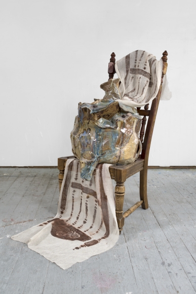 a chair artwork by jessica jackson hutchins with ceramic sculptures on it