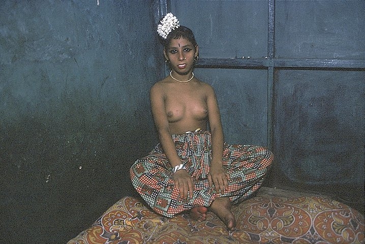 Semi-nude Kanta in the Corner of her bed, Bombay, India (from Falkland Road Series), 1978, Cibachrome