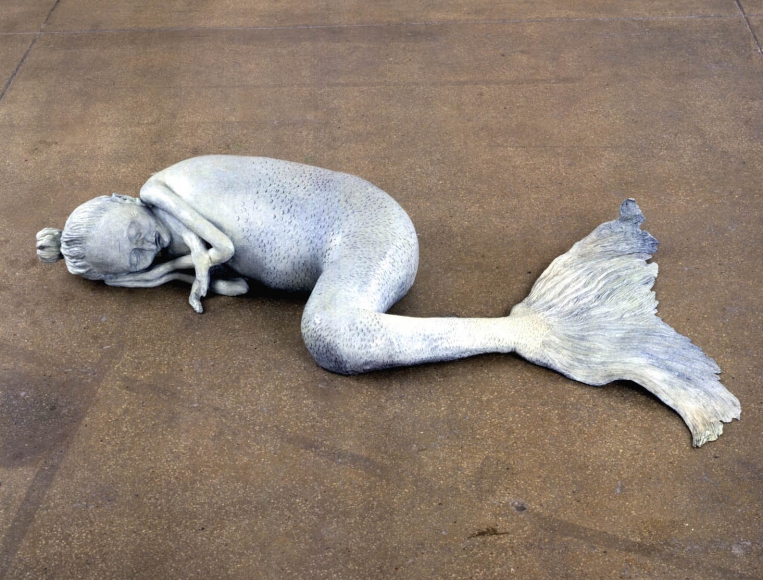 sculpture of a sleeping mermaid by liz craft