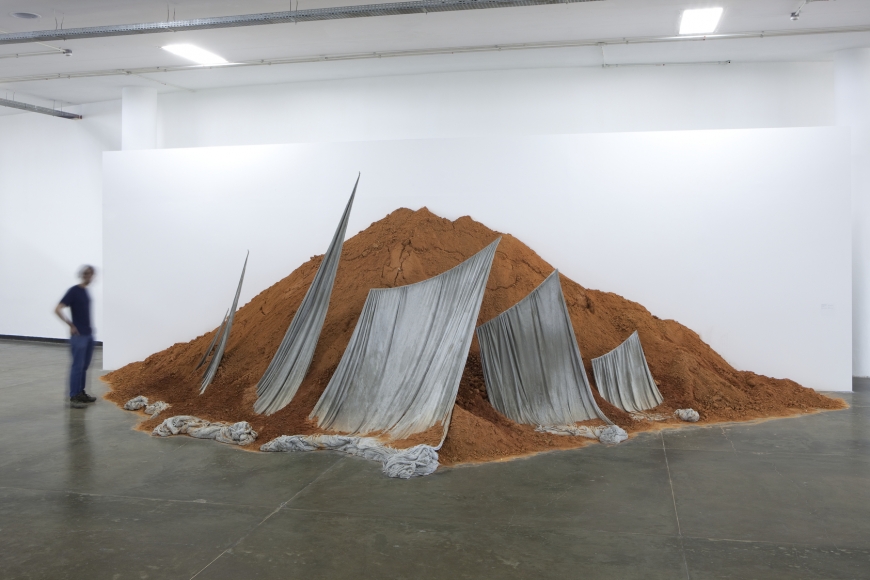 an installation with soil and sails by contemporary artist thiago rocha pitta