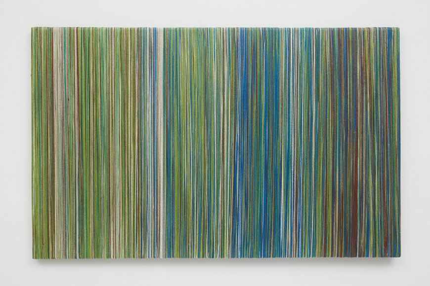 Wood board covered with thin lines of linen yarn by Sheila Hicks