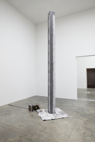 installation by pier paolo calzolari featuring a freestanding lead column