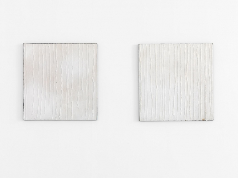 diptych with two white panels made of salt and lead by pier paolo calzolari