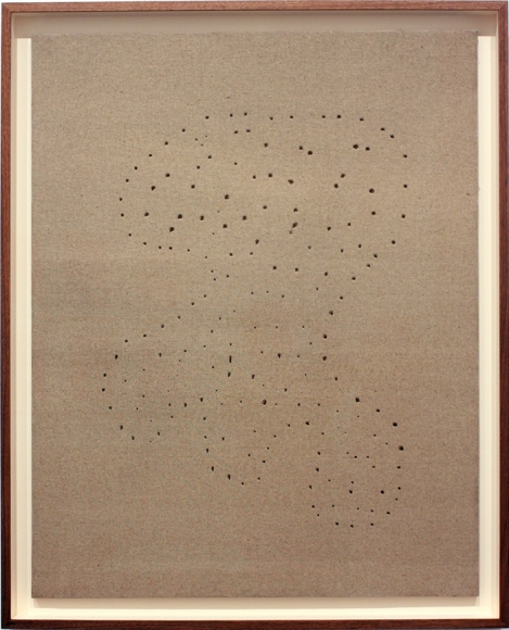 beige painting by lucio fontana with constellation of holes