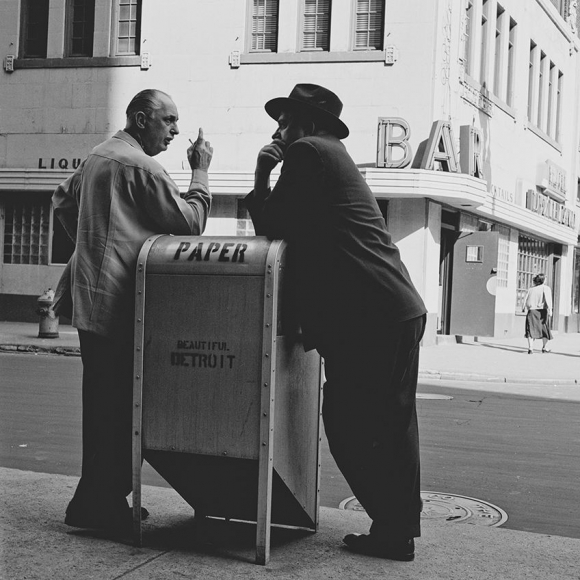 photograph of two men talking over a mailbox by bill rauhauser