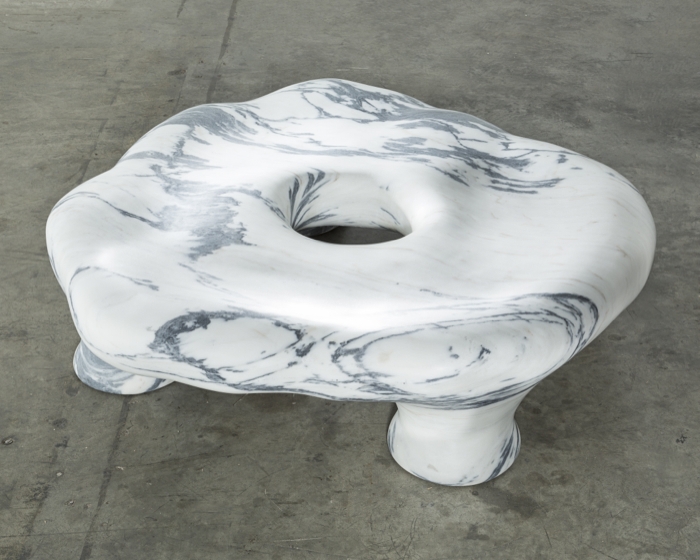 a marble seat by the Haas Brothers- a Pele de Tigre marble sculpture