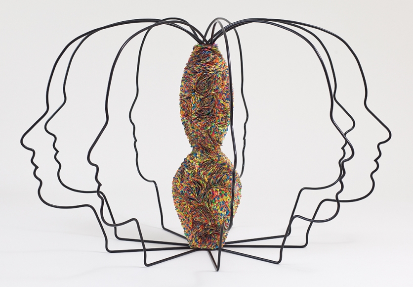 wire sculpture by mindy shapero with eight attached heads