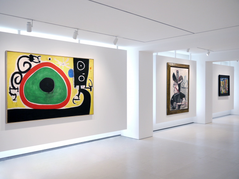 Installation view of Selected Works by 20th Century Masters featuring three paintings on the same wall of the main gallery space. From left to right, Joan Miró, Oiseaux en Fête pour le lever du Jour, 21 Mars 1968, 1968 Oil on canvas 130 x 195 cm. (51 1/8 x 76 3/8 in.), Pablo Picasso, Mousquetaire aux Oiseaux II, 13 January 1972, 1972 Oil on canvas 146 x 114 cm. (57 1/2 x 44 7/8 in.), Fernand Léger, Objets dans l'espace, 1931 Oil on canvas 73 x 92 cm. (28 3/4 x 36 1/4 in.). Photography by Bianca Boragi. ©Helly Nahmad Gallery NY.