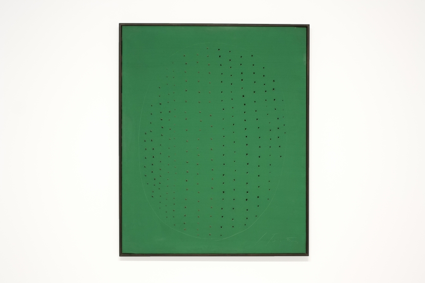 This is an installation view of a Lucio Fontana Painting.