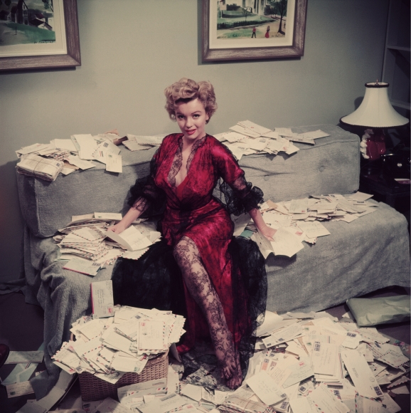 Slim Aarons, Fan Mail, 1952: Marilyn Monroe sorts out her fan mail shortly after her film “The Asphalt Jungle” had been released, Beverly Hills
