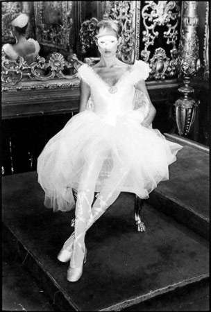 Chris von Wangenheim, Model in white dress and mask, circa 1978