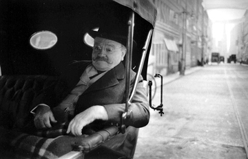 Mary Ellen Mark, James Cagney relaxes in a carriage on the set of Ragtime, London, England, 1980