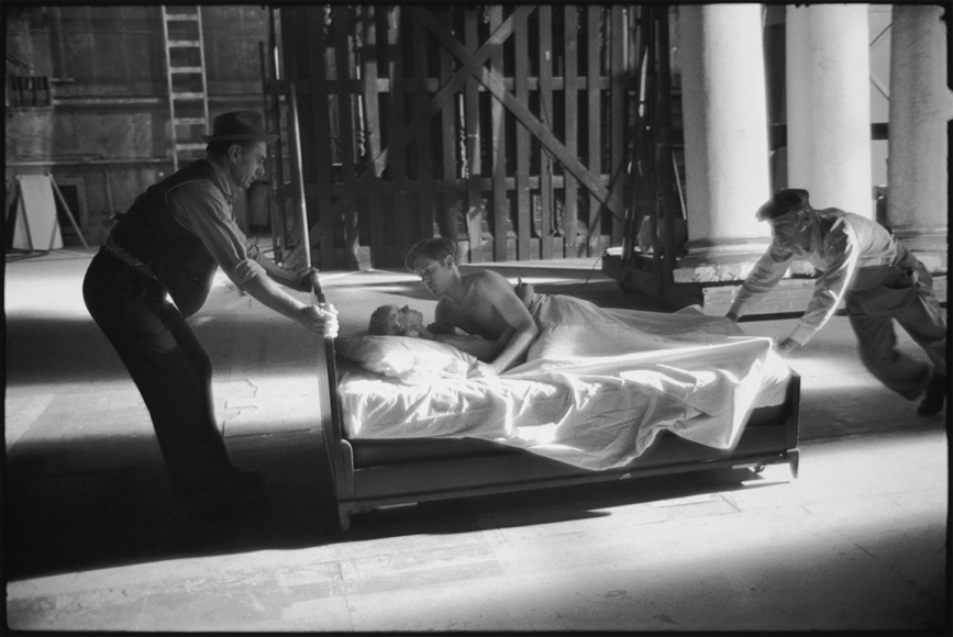 Mary Ellen Mark, Karen Black and Bill Atherton being moved to another location on the set of The Day of the Locust, Los Angeles, California, 1974