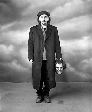 Mary Ellen Mark, Tim Burton with a severed head prop, Sleepy Hollow, Shepperton Studios, England, 1999