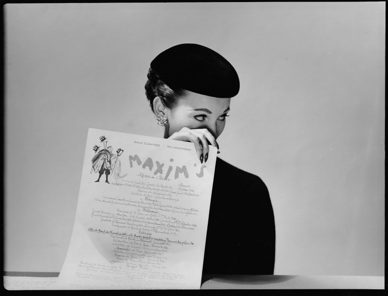Louise Dahl-Wolfe, Model with Menu for Maxim's, 1951