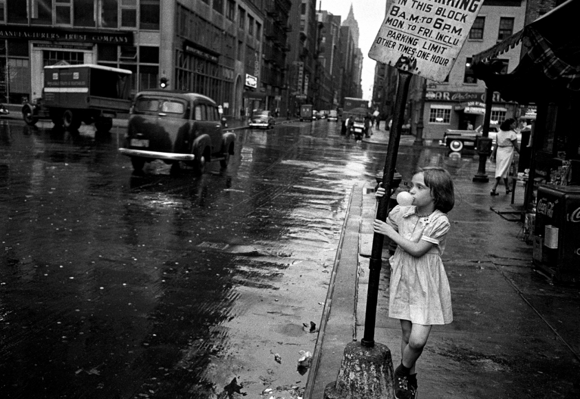 Girl blowing bubble by Vivian Cherry