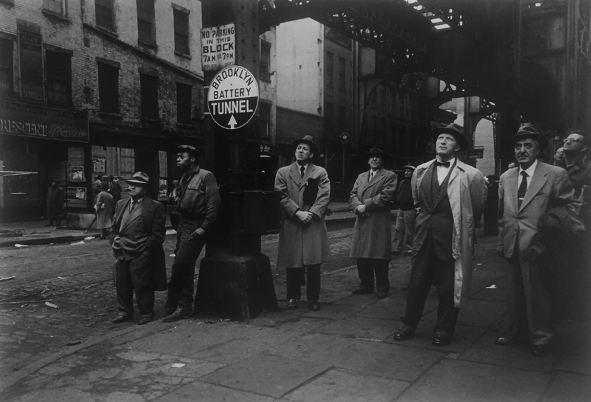 Men watching construction by Vivian Cherry
