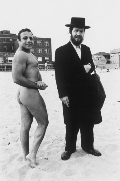 Nude and clothed man on beach by Arlene Gottfried