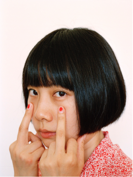 Woman with red nail polish by Pixy Liao