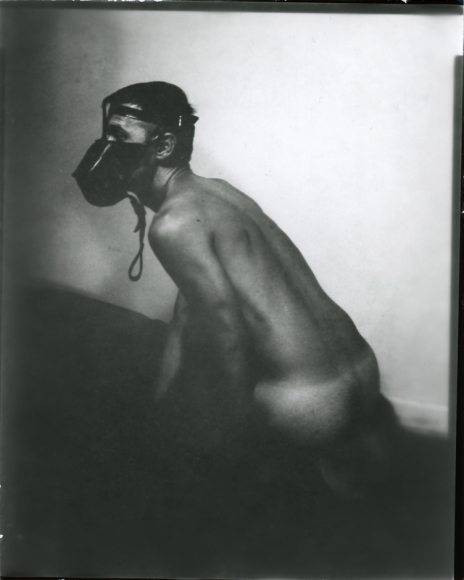 Man with dog mask by Benjamin Fredrickson