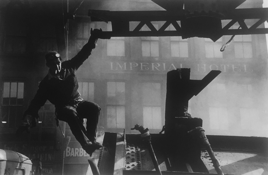 Construction worker on beam by Vivian Cherry