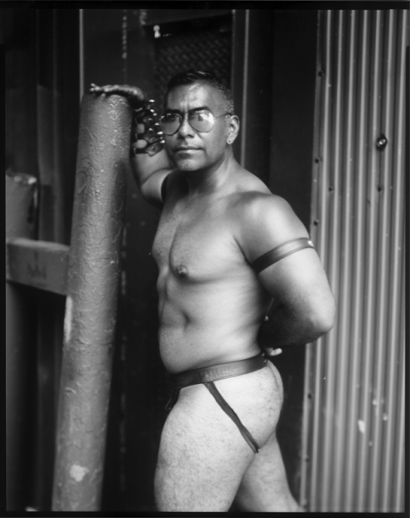 Man in leather jockstrap by Benjamin Fredrickson