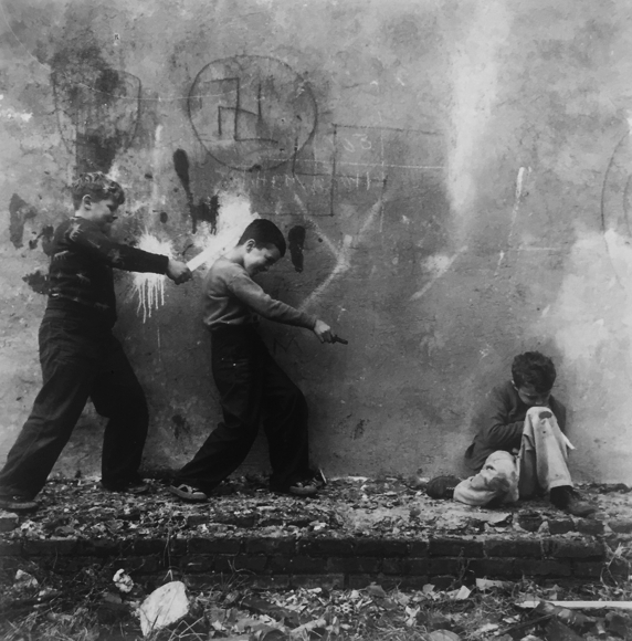 Three boys playing by Vivian Cherry