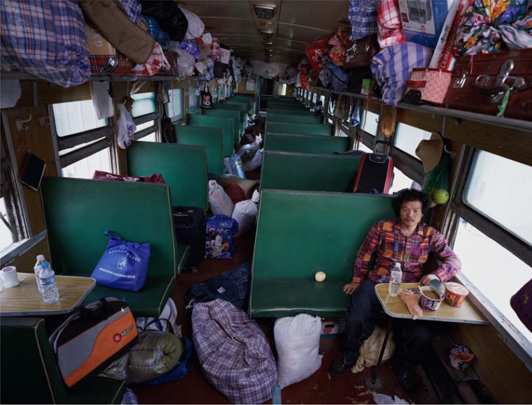 Wang Qingsong. Hard-seat Compartment, 2008. C-print, 160 x 210 cm, center. Courtesy of the artist & PKM Gallery.
