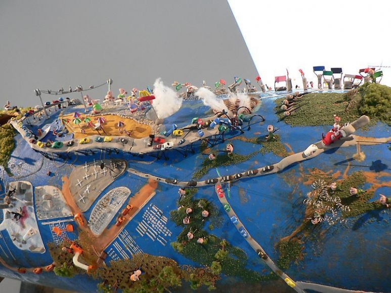 Ham Jin. City on the bombshell(second story), 2008. Polymer clay and mixed media on cast bombshell, 220 x 40 x 30 cm. Courtesy of the artist & PKM Trinity Gallery.