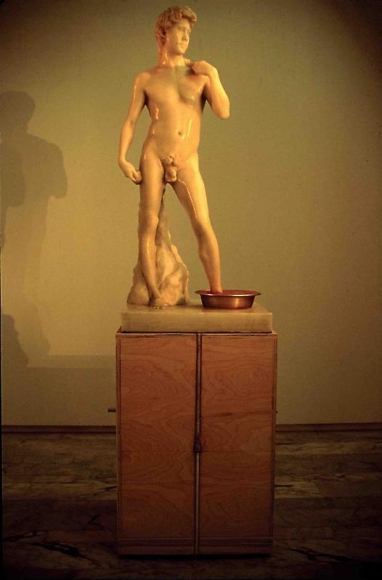 Cody Choi. Cody's Legend Freud's Shit Box, 1994-95. Wax, Pepto-bismol, banding straps, yellow tin, aluminium, wood and steel, 97 x 97 x 264 cm. Courtesy of the artist & PKM Gallery.
