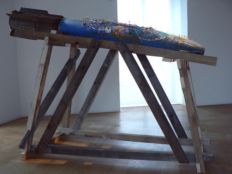 Ham Jin. City on the bombshell(second story), 2008. Polymer clay and mixed media on cast bombshell, 220 x 40 x 30 cm. Courtesy of the artist & PKM Trinity Gallery.