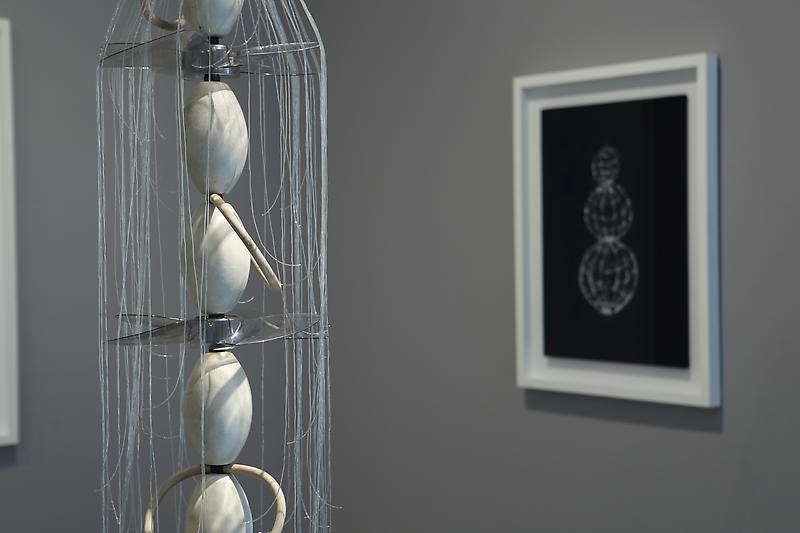 Minouk Lim. Suyu-ri, 2011. Buoys, wooden beads, plastic fans, urethane cord, wood, metal, 203 x 34.5 cm diameter; Happy Days, 2011. Powdered cuttlefish bone on velvet, 95 x 75 x 4.5 cm (including frame). Courtesy of the artist & PKM Gallery.