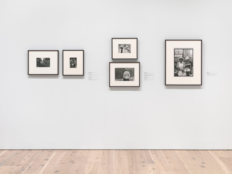 Installation view of Working Together: The Photographers of the Kamoinge Workshop (Whitney Museum of American Art, New York, November 21, 2020–March 28, 2021). From left to right, top to bottom: Al Fennar, Caddy, 1965; Anthony Barboza, NYC, c. 1970s; Shawn Walker, Easter Sunday, Harlem (125th Street), 1972; Anthony Barboza, NYC, c. 1970s; Ming Smith, Amen Corner Sisters, Harlem, NY, c. 1976. Photograph by Ron Amstutz