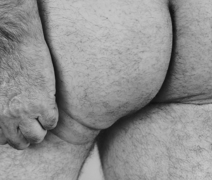 Hand with Buttocks, 1987, Gelatin silver print mounted to board
