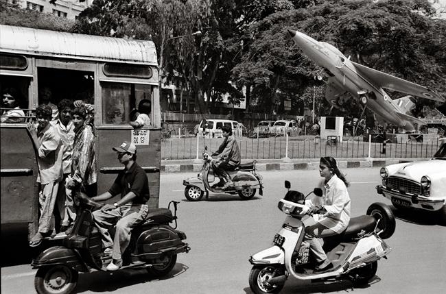 Raghu Rai Fighter Plane in City Traffic, Bangalore