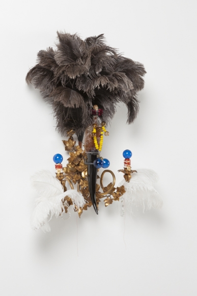 Rina Banerjee, Sex-bait, in likeness to fish bait to catch her as disloyal, in likeness to Eve, arouse her fear, to create racial panic of blacks jewels like honey to stir and stir poison n' passion, minted lynchings in likeness to money.