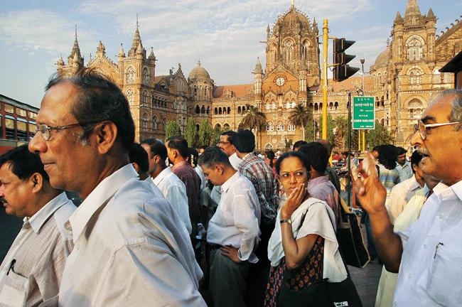 Raghu Rai Office goers at Victoria Terminus, Mumbai