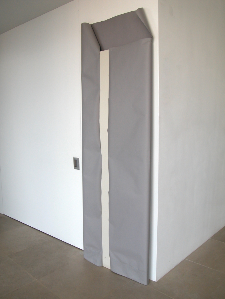 The Is Should Be Capitalized, 2008, Hollow core door, paper, staples, 90 x 30.5 x 3 inches