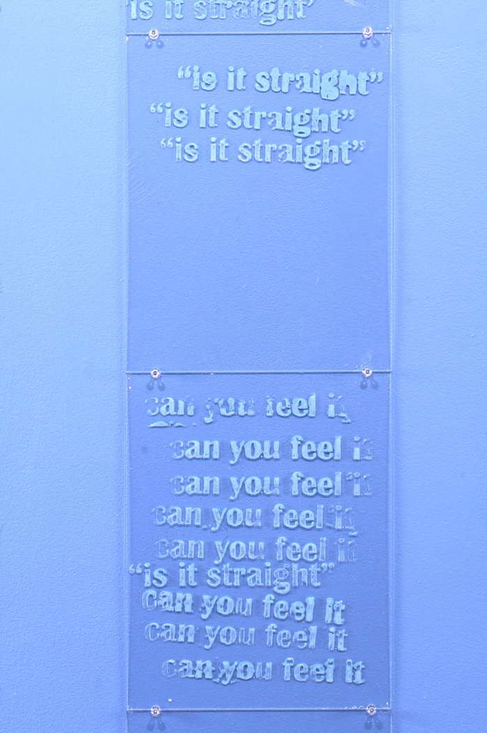 Mark Bradford, Lot's Wife, 1997 (detail), 9 plexiglass pieces with text, 11 x 14 inches each, sky blue painted wall, Dimensions variable