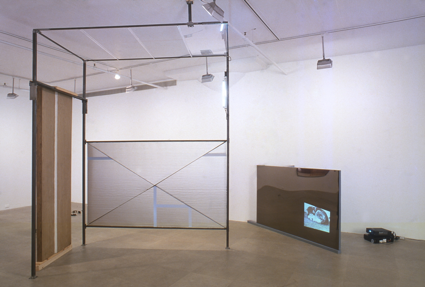 Heidie Gianotti, When Suburban Living Was Good, 2001, Steel, plexi, insulation, caulking, vinyl, super 8 film, Dimensions variable