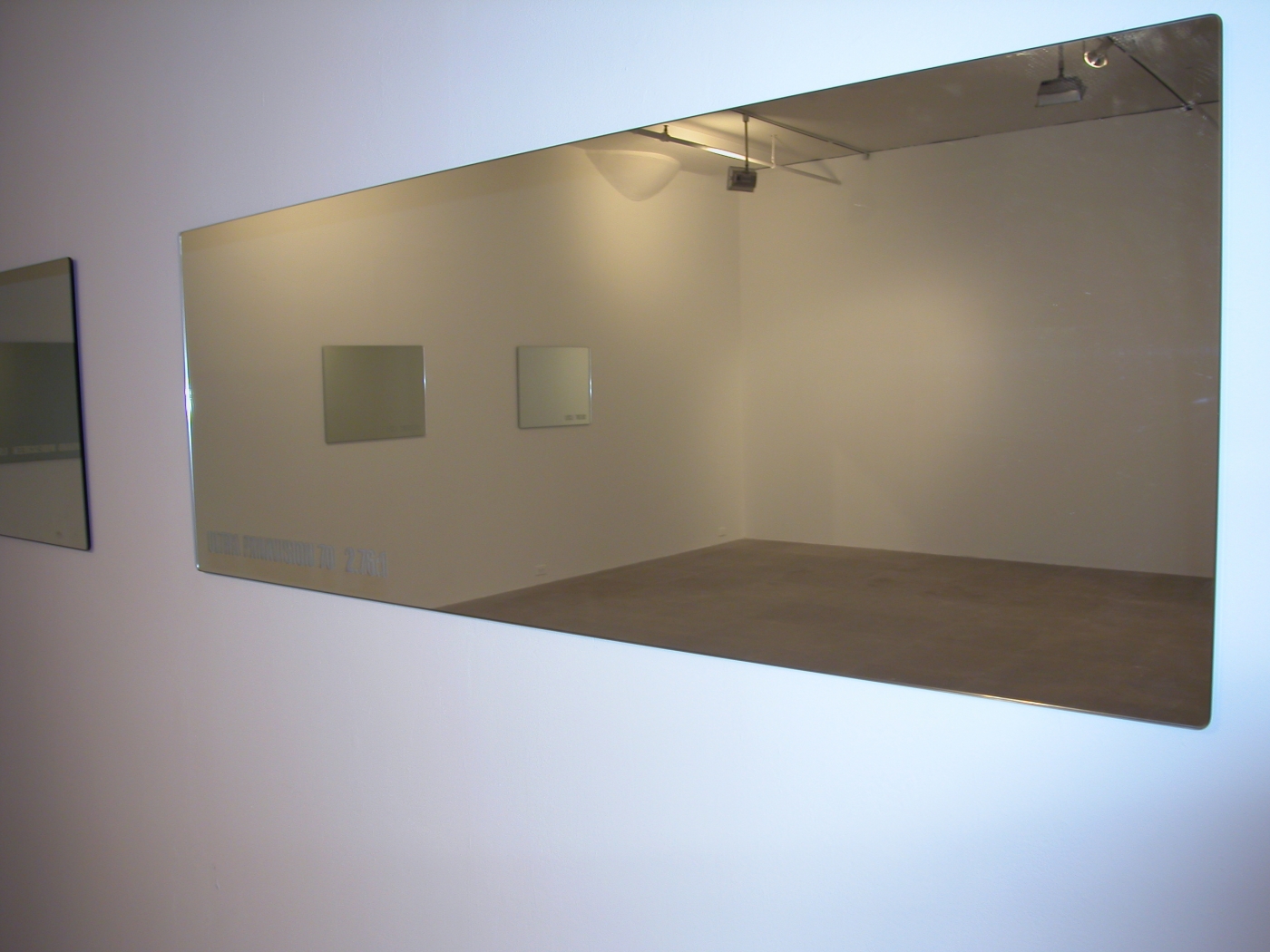 Ultra Panavision 70 2.76:1, 2004, mirrored glass, 24 x 66 1/4 inches 61 x 168.3 cm