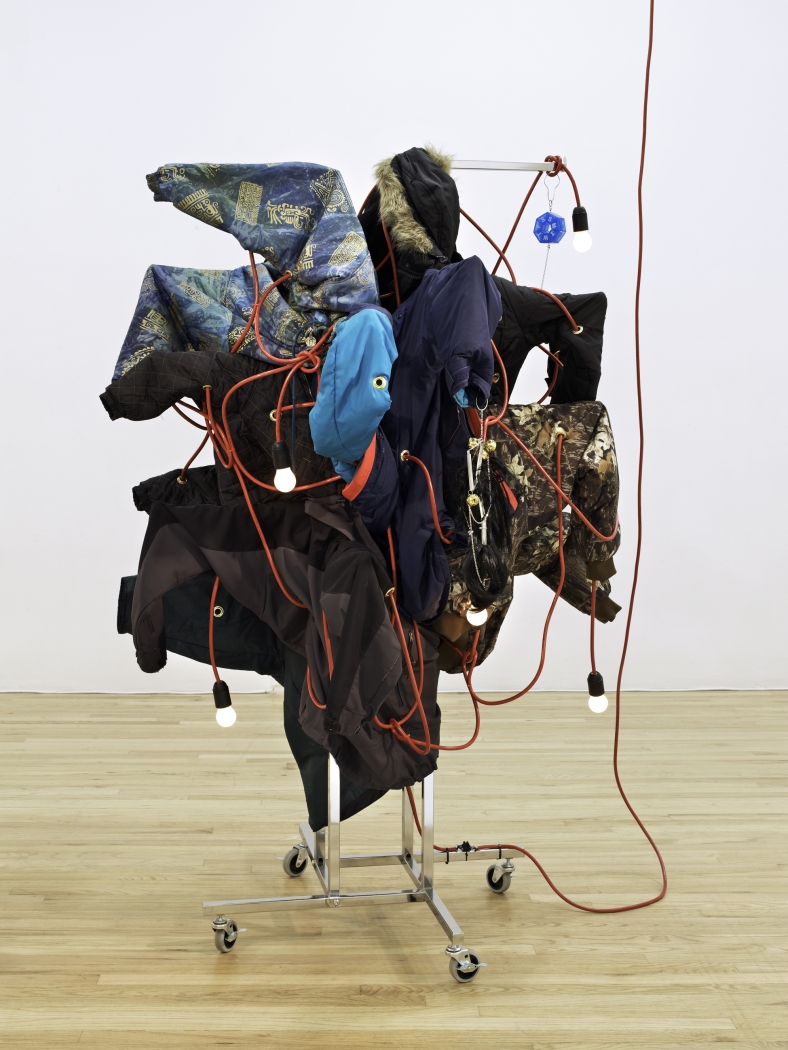 Haegue Yang Wild in Aspen: Wrapping up the Season, 2011 Four-way straight-arm clothing rack (chrome) on casters with nineteen arms, light bulbs (frosted), cable, bells, wigs, pillbox, chain, folder clips, winter coats, and jackets 72 x 36 x 36 inches (182.9 x 91.4 x 91.4 cm) Installation view, The Art and Technique of Folding the Land, curated by Heidi Zuckerman Jacobson, Aspen Art Museum, Aspen, Colorado, 2011