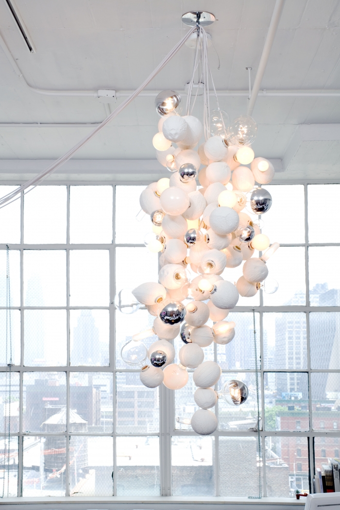 Untitled, 2009, 68 cast coconuts, electrical wiring, light bulbs, Overall dimensions variable, Installation view, Greene Naftali, New York, 2009