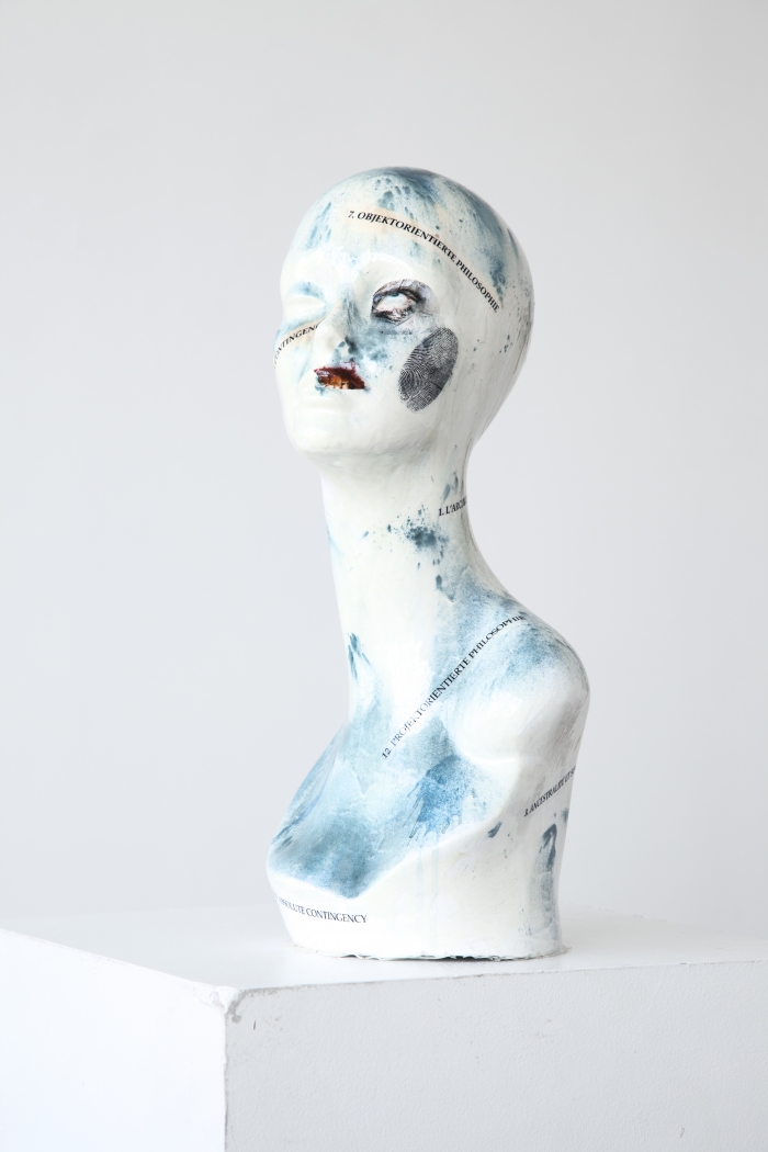 Mathieu Malouf Slave (Object-Oriented Philosophy), 2012 Decals, enamel, spirulina powder, epoxy resin on heads 19 x 8 1/2 x 8 1/4 inches (48.3 x 21.6 x 21 cm)