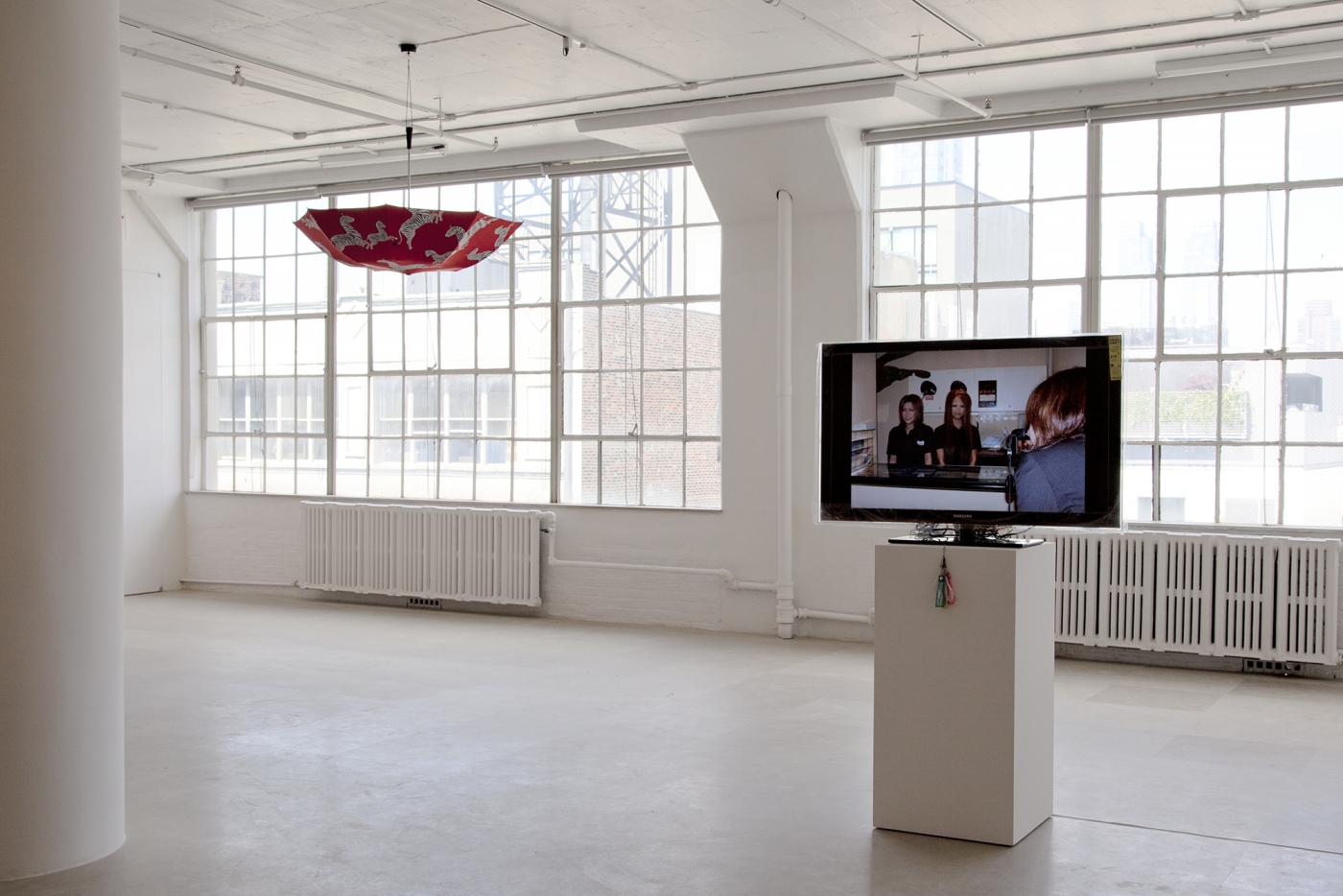 Ei Arakawa / United Brothers (w/ Das Institut), BLACKY Blocked Radiants Sunbathed, 2011, Digital projection of 185 slides with a set of mobile straps, Dimensions variable, Ed. 1/3, 2 APs, Installation view, Greene Naftali, New York, 2011