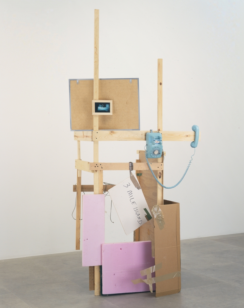Rachel Harrison, In the Zoo, 2001, Wood, polystyrene, screws, cardboard, tape, foam core, corkboard, permanent marker, rotary phone, and chromogenic print, 96 x 42 x 24 inches (243.8 x 106.7 x 61 cm)