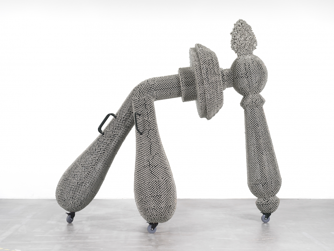 Haegue Yang Sonic Handles – Law of Three Bodies 2019 Powder-coated aluminum frame, powder-coated metal grid, nickel plated bells, metal rings, casters