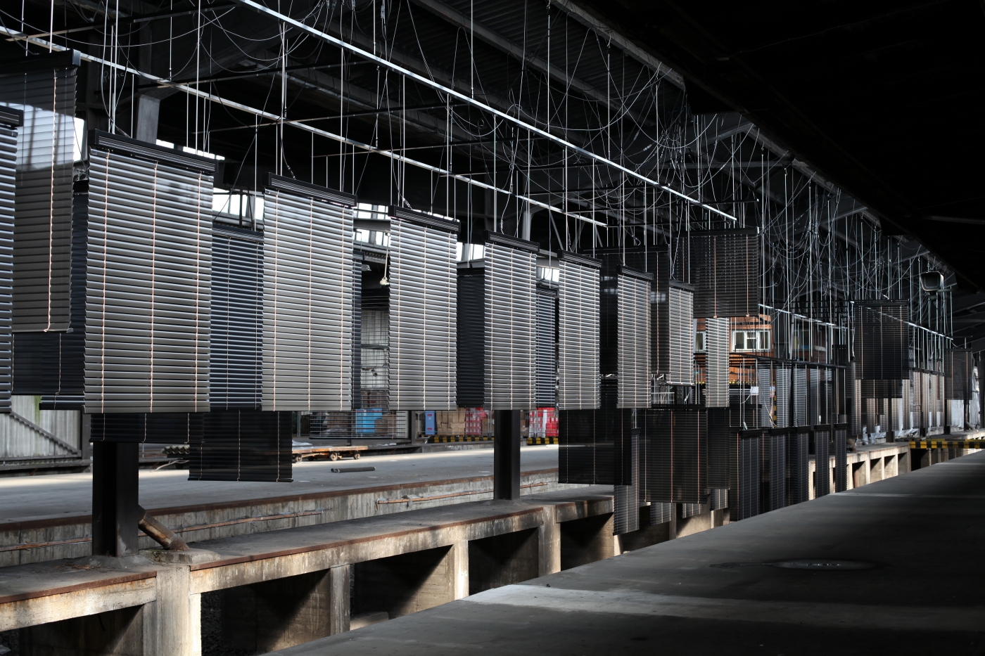 Haegue Yang Approaching: Choreography Engineered in Never-Past Tense, 2012 Installation with motorized aluminum venetian blinds, aluminum hanging structure Dimensions variable Installation view, dOCUMENTA (13), Kassel, 2012