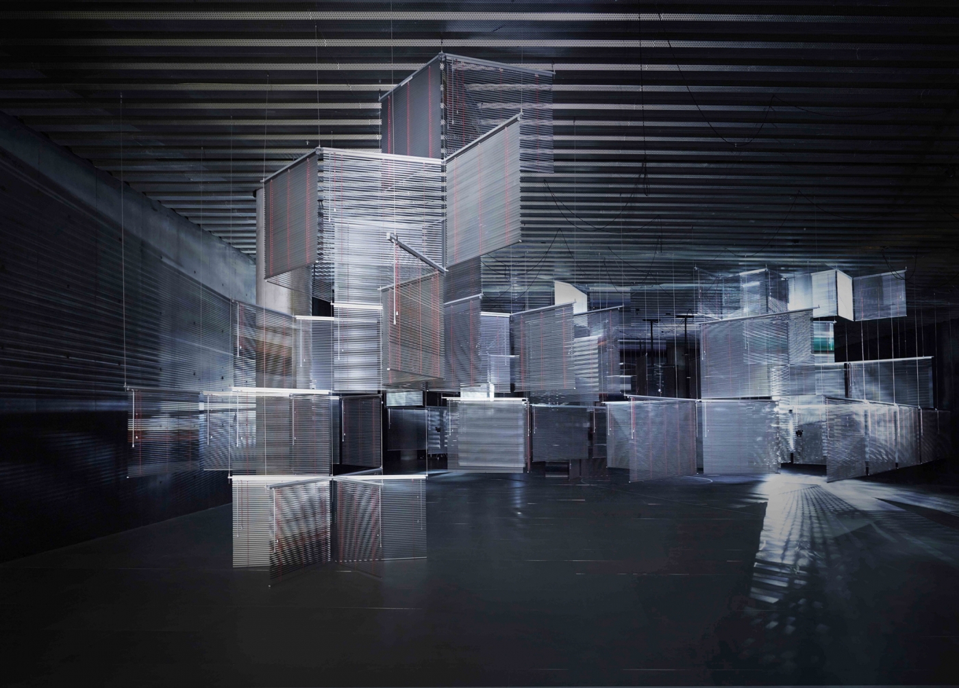 Cittadella 2011 Aluminum Venetian blinds, aluminum hanging structure, powder coating, steel wire, moving spotlights, scent emitters (Campfire, Mountain Mist, Oudh, Rainforest, Cedarwood, Ocean, Fresh Cut Grass, Tamboti Wood) Dimensions variable