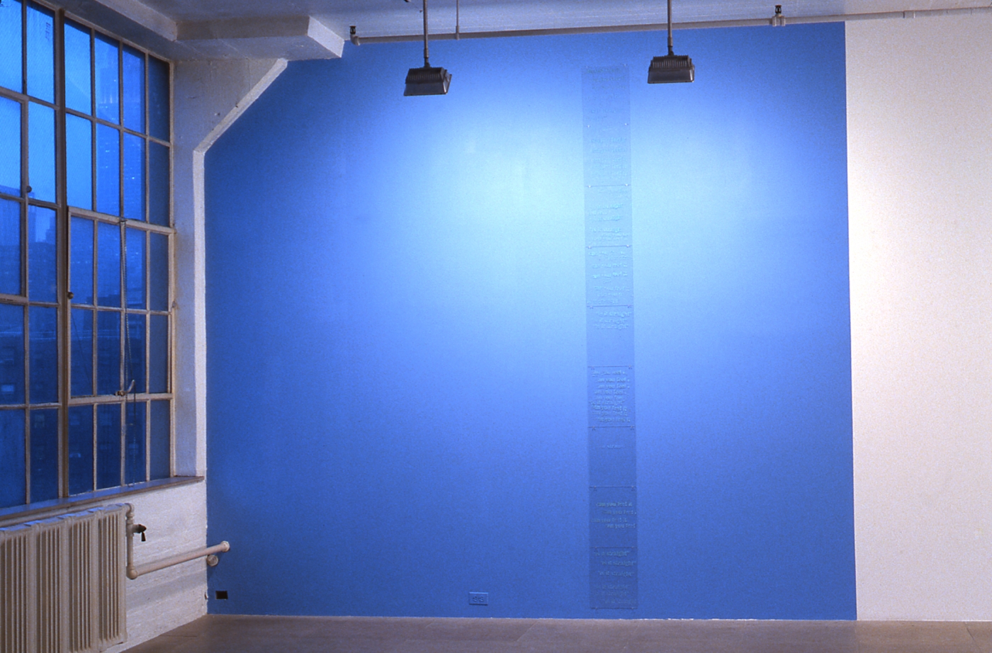 Mark Bradford, Lot's Wife, 1997, 9 plexiglass pieces with text, 11 x 14 inches; sky blue painted wall, dimensions variable